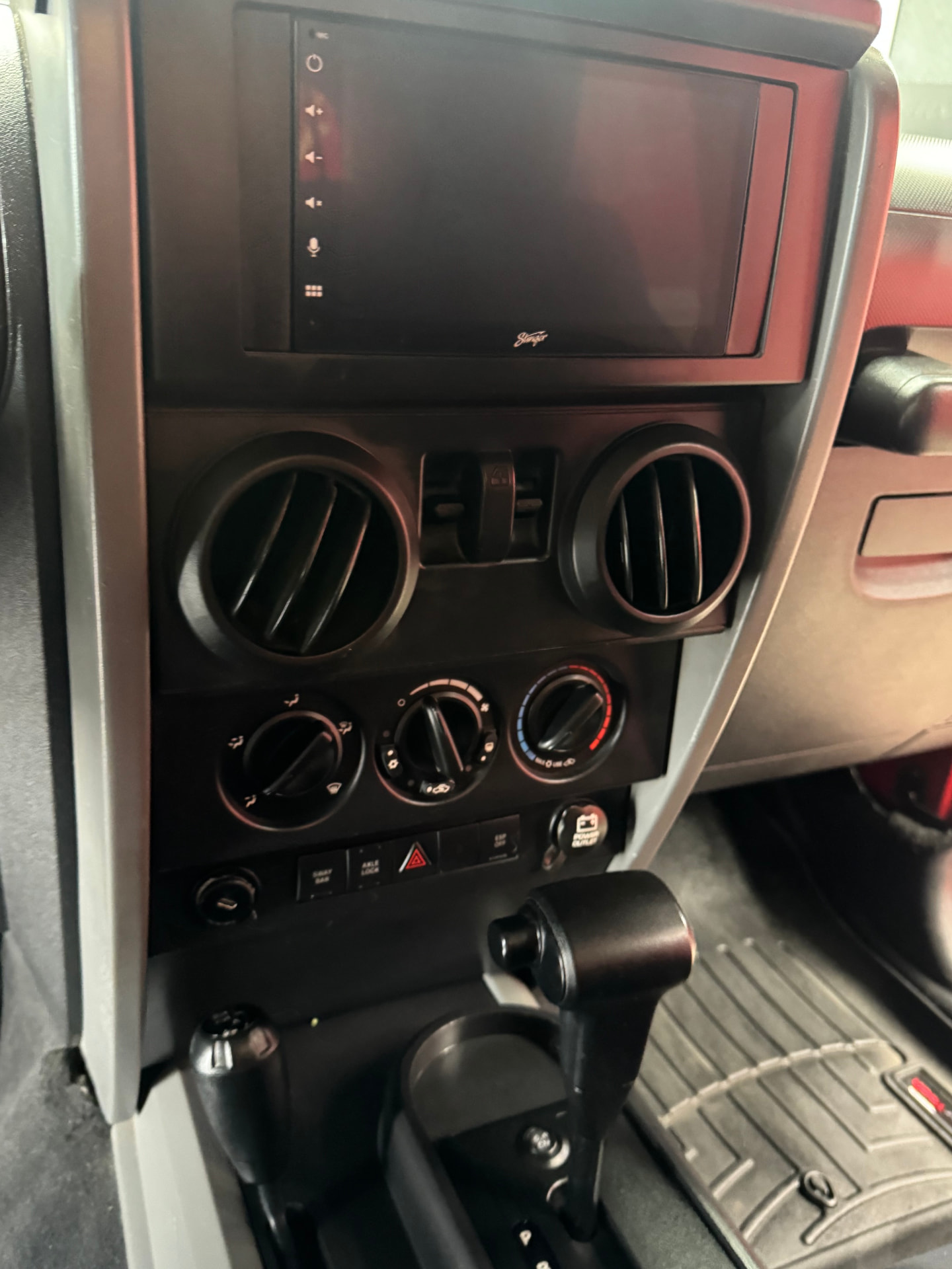 Stinger touchscreen head unit and climate controls in Skadi's center stack
