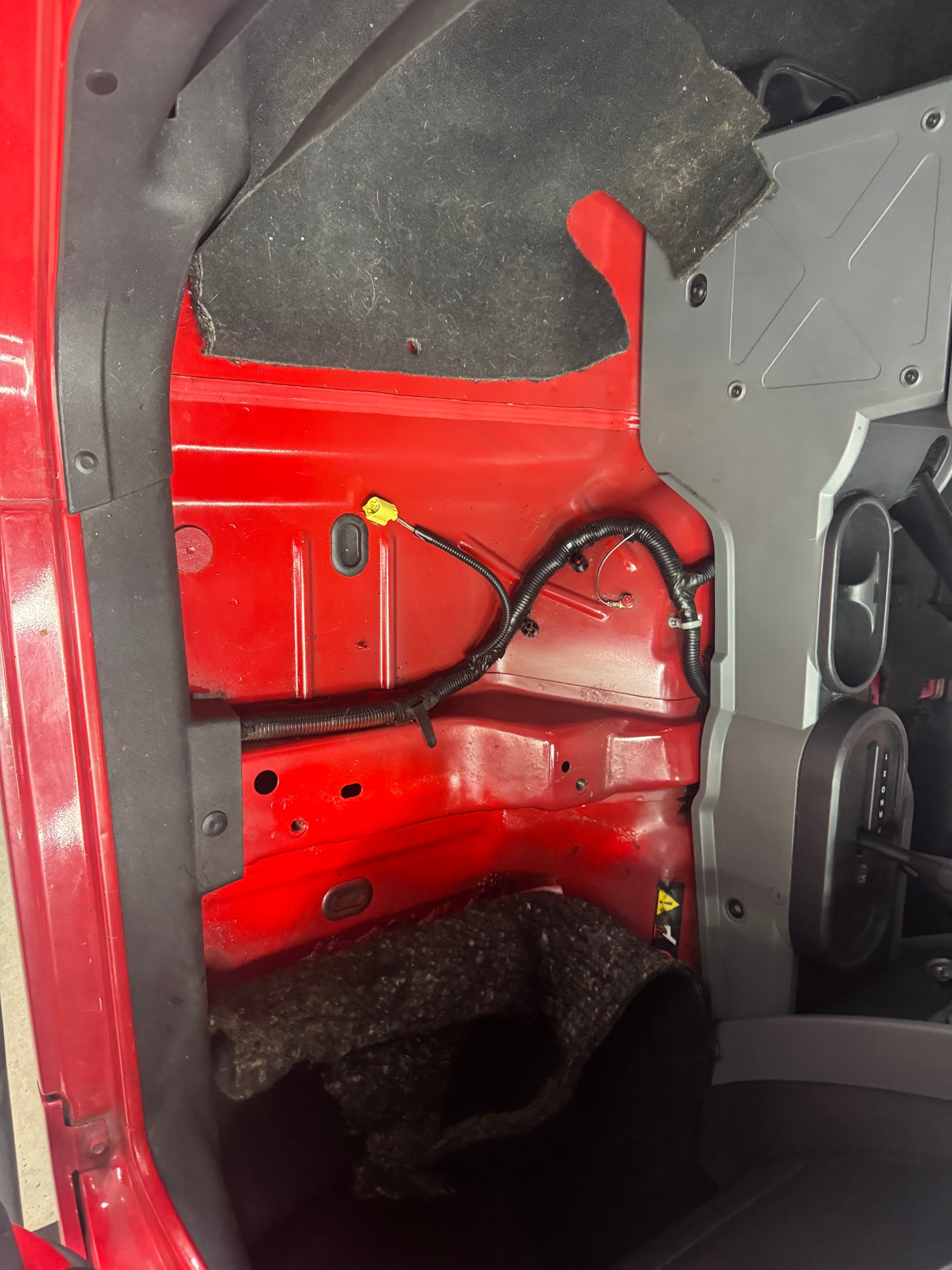 Rust-free red floor pan exposed with carpet removed