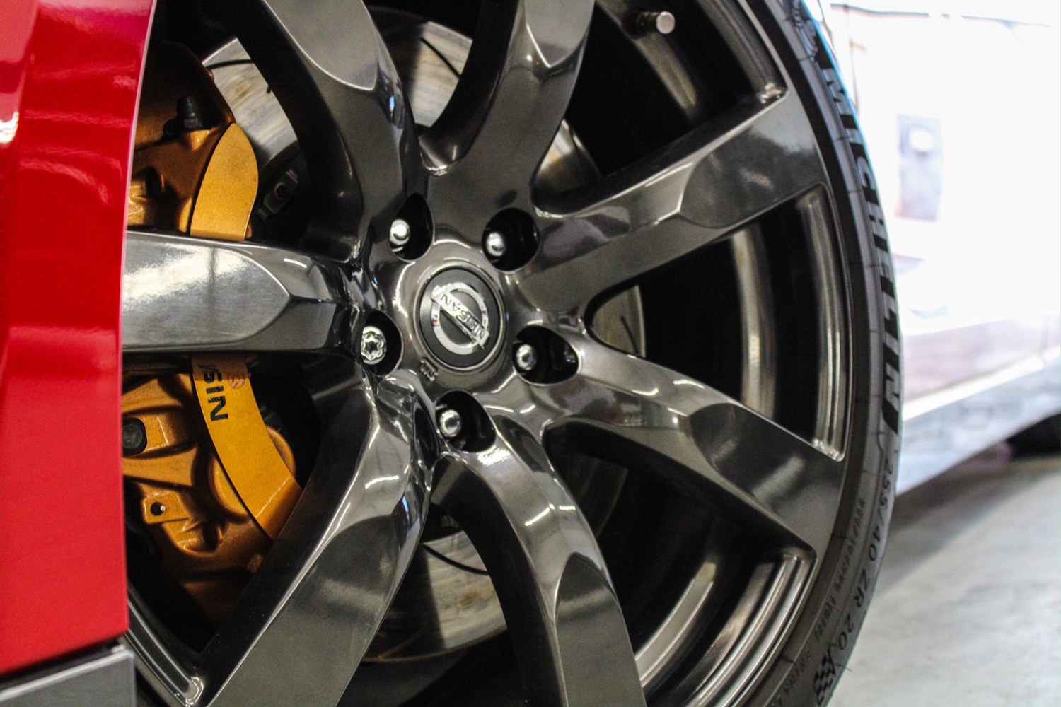 GT-R wheel and gold Nismo brake caliper close-up