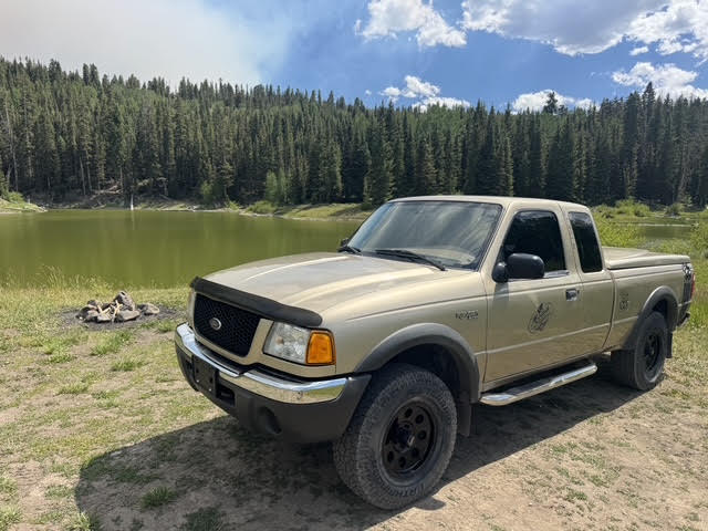 Ragnar front three-quarter at an alpine lake campsite