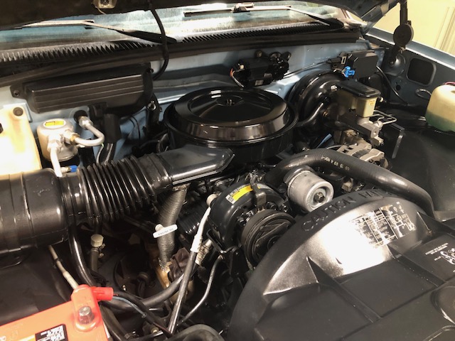 GMC Sierra engine bay after detail and refresh